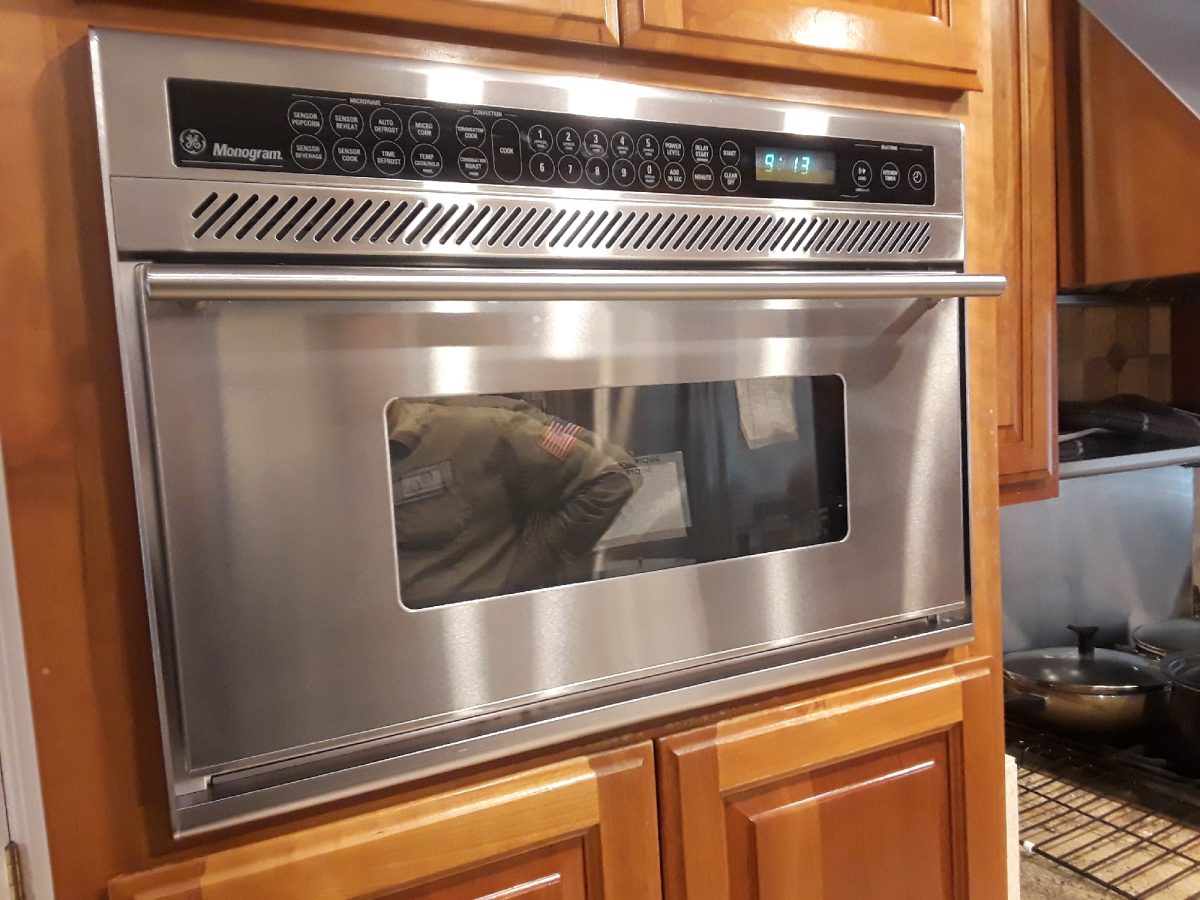 Replacing a magnetron in a microwave GE Monogram. Repair in Fremont, California